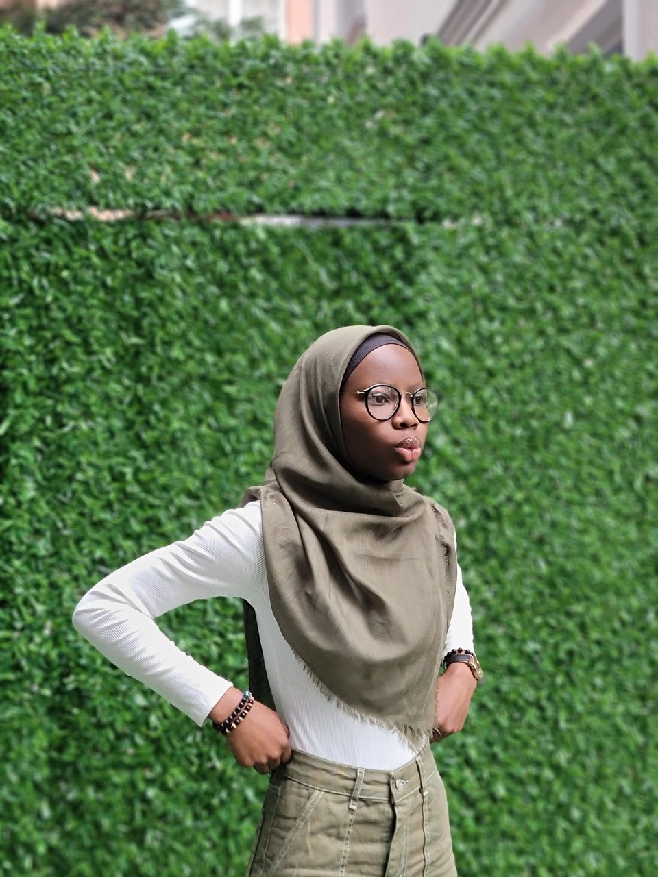 Azizah in traditional attire smiling